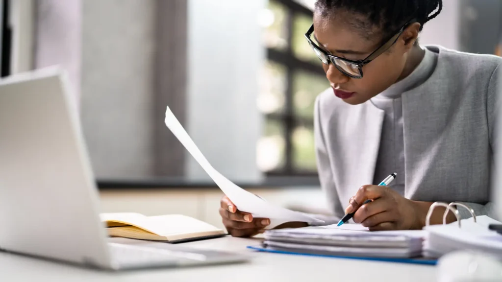 woman at desk with laptop
