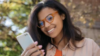 Girl looking at her phone and smiling