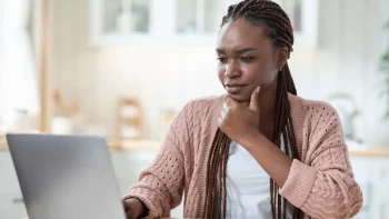 Woman at home working on her laptop