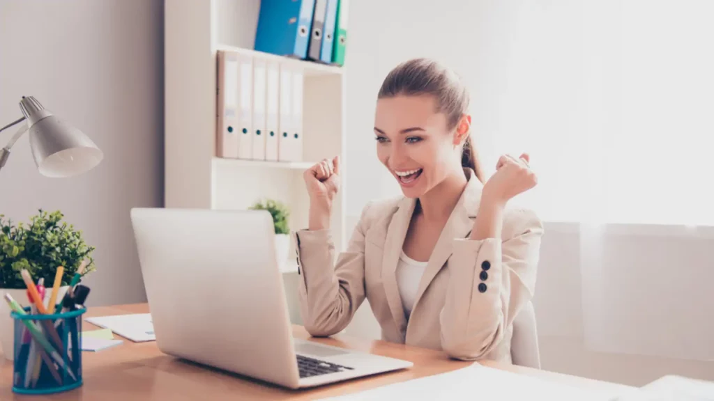 Happy woman at her work desk