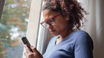 Agitated woman looking at her phone