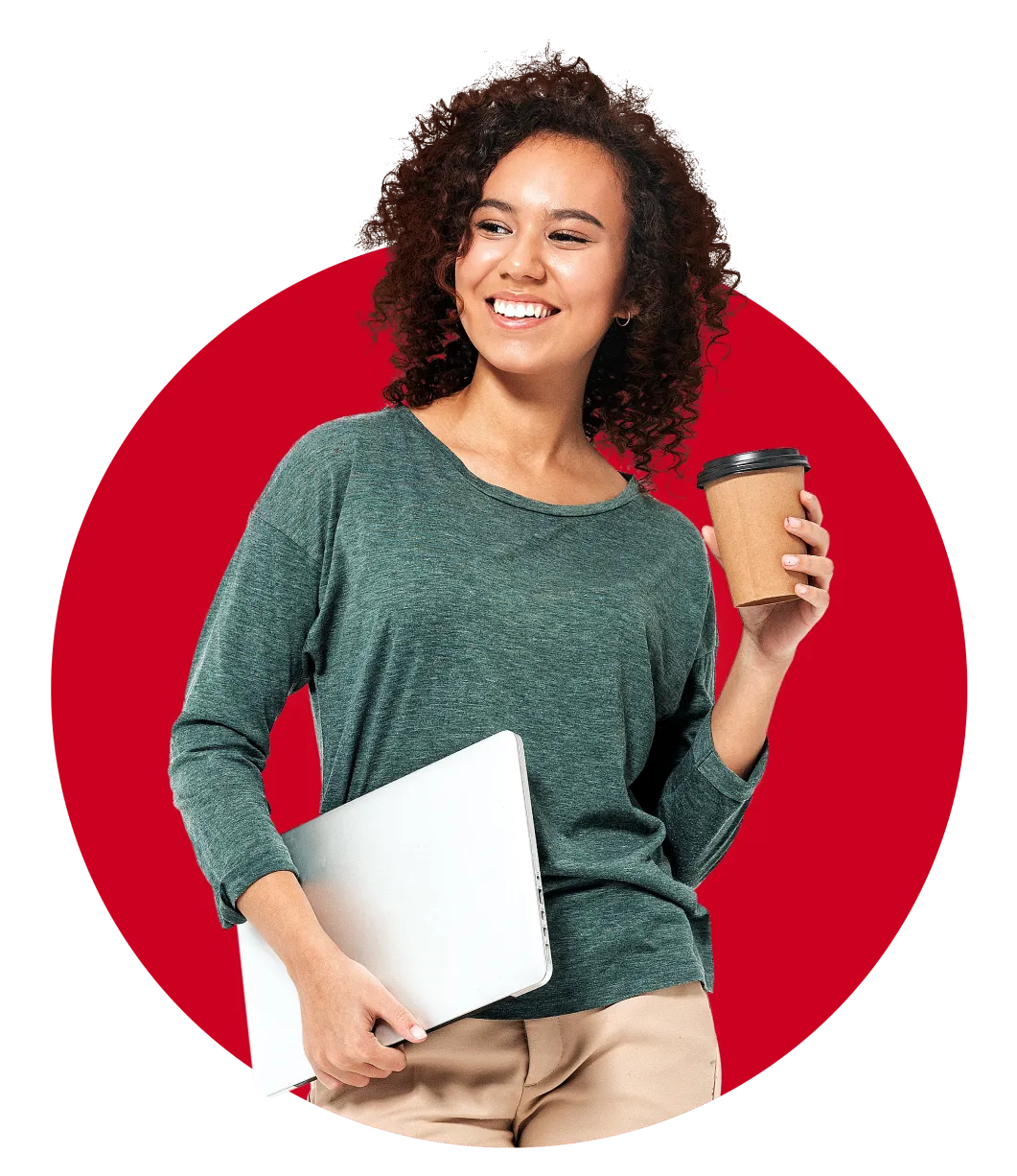 Woman with curly hair holding a laptop in one hand, and a coffee cup in another