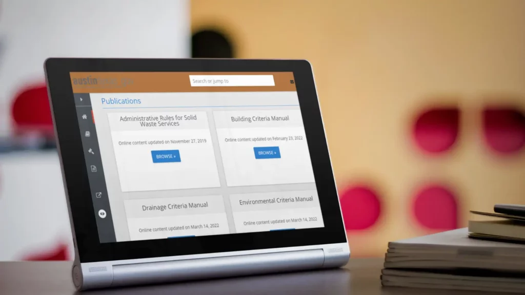 A tablet screen displaying the homepage of Austin goverment's website