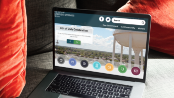 Laptop screen displaying the City of Carrizo Springs TX website homepage