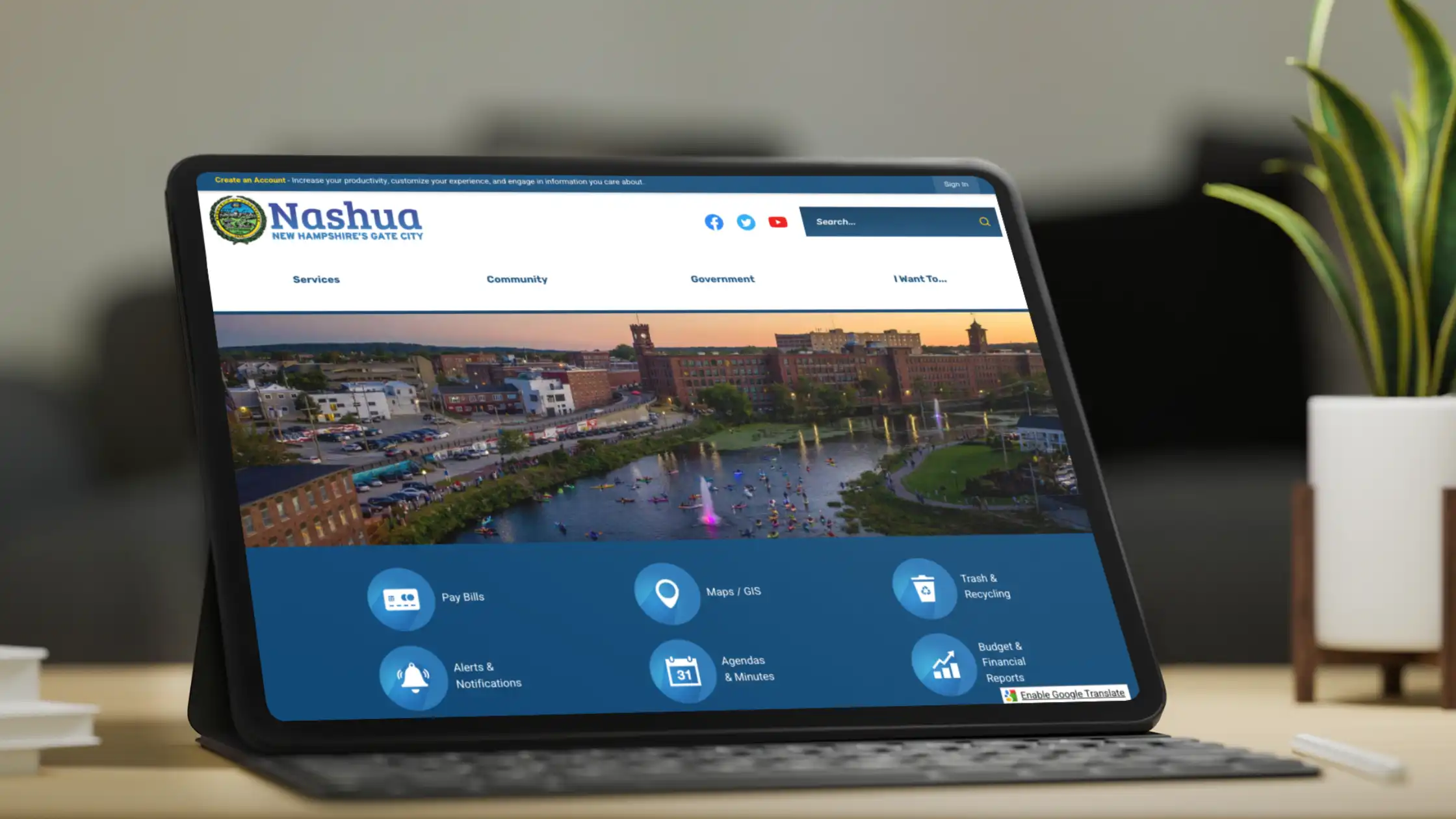 Tablet with keyboard displaying the City of Nashua website homepage