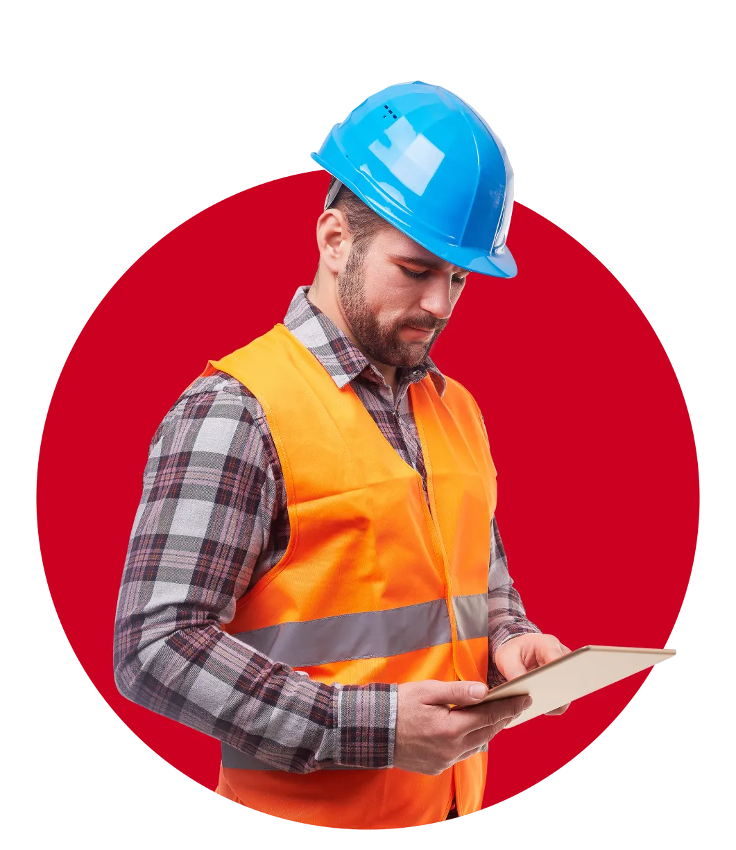 A constructor worker in uniform holding a tablet in both hands