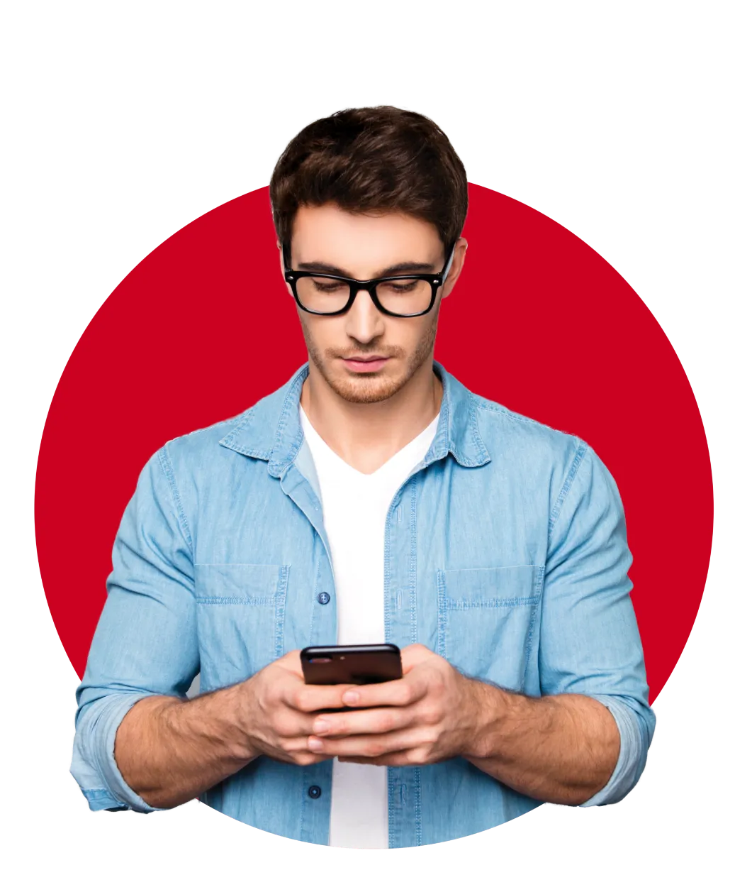 Man wearing glasses holding a phone in both hands