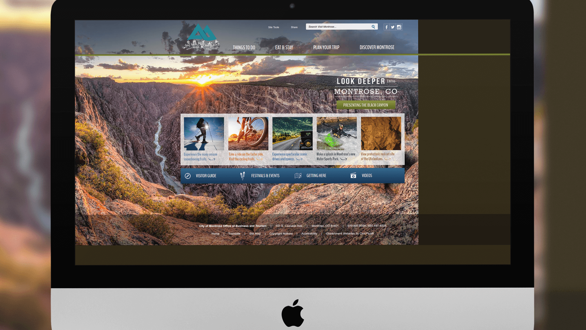 Imac computer screen displaying the Montrose website homepage