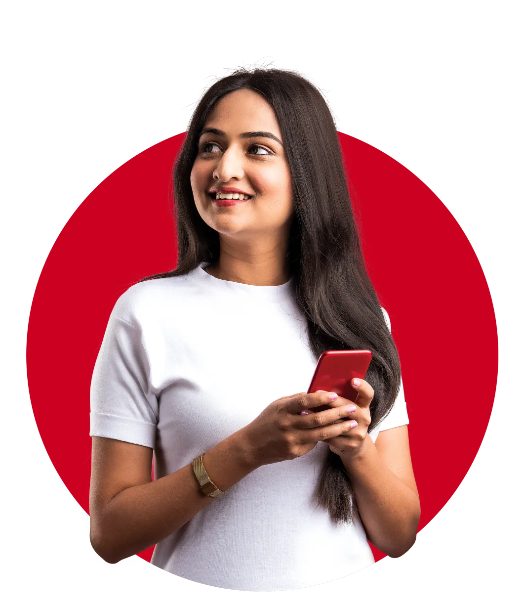 Woman holding a phone and smiling in a red background