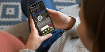 Woman looking at the City of Manitou Springs website on her smartphone