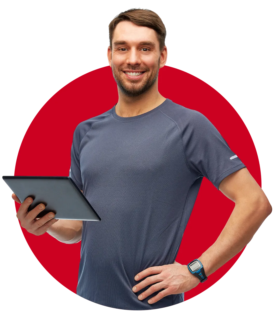 Man holding a tablet in one hand, smiling.