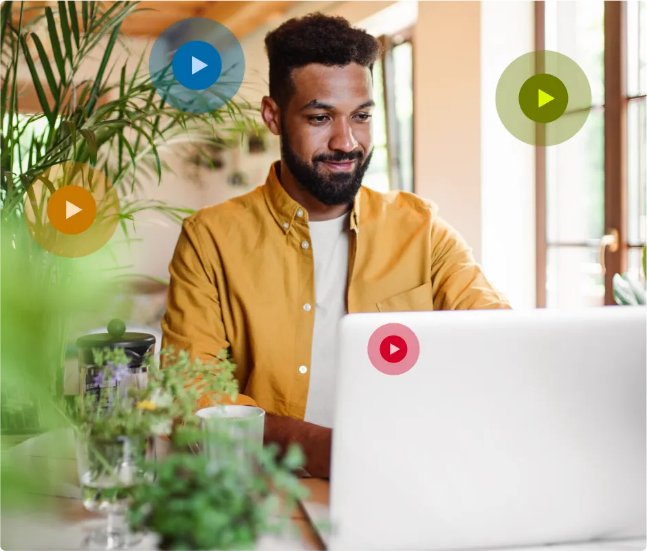 Man sitting in a cafe working on a laptop