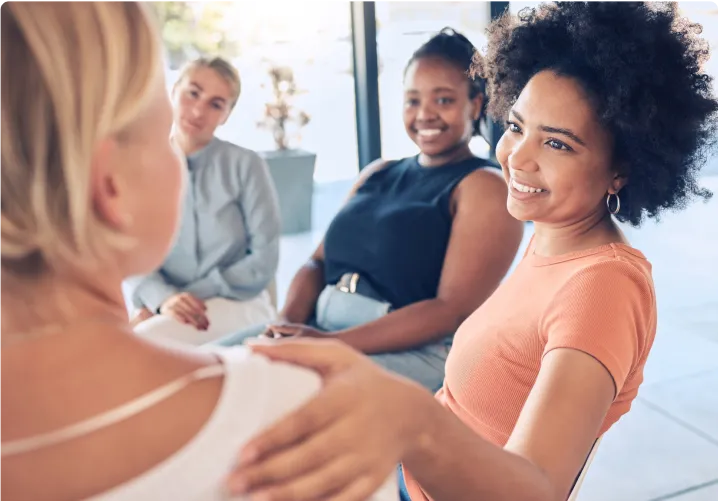 Group of woman co-workers seated around a table