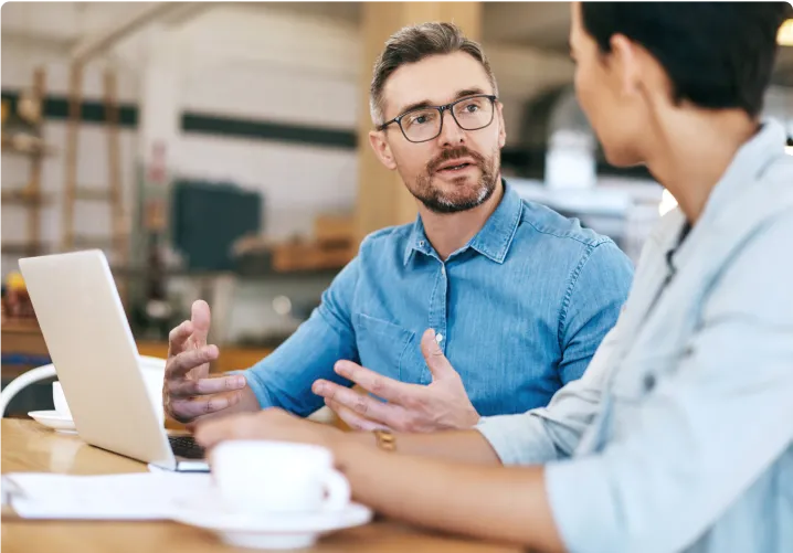 Man and woman in an office having a discussion