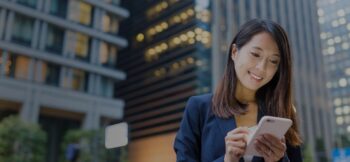 Woman using a phone in the city