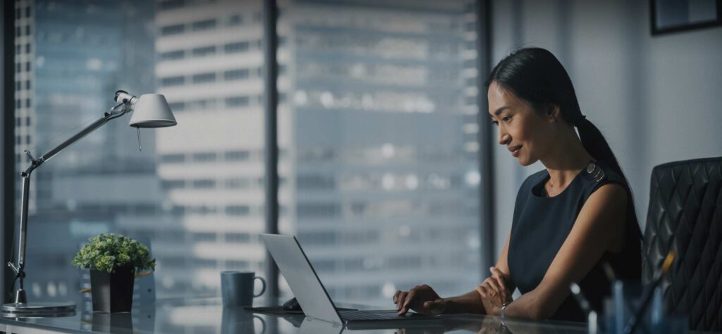 Woman using a laptop in a office