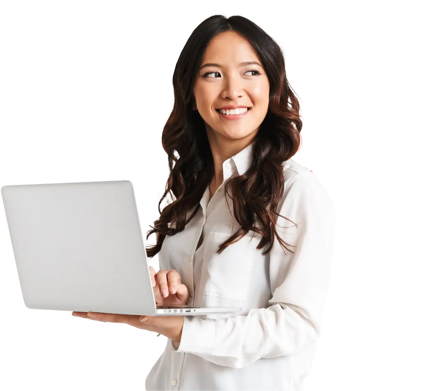 Woman holding a laptop in one hand, looking sideways and smiling