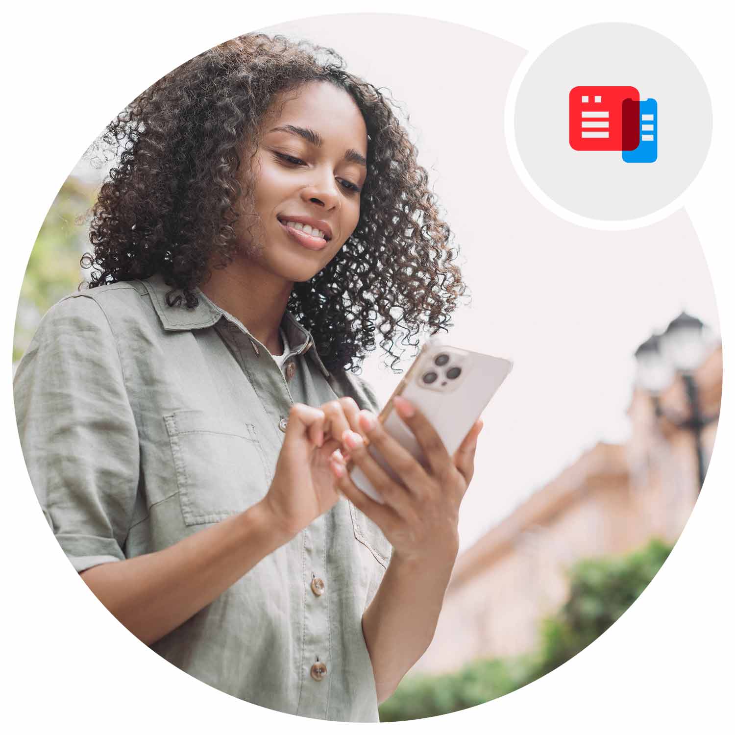 A woman using a phone outdoors.