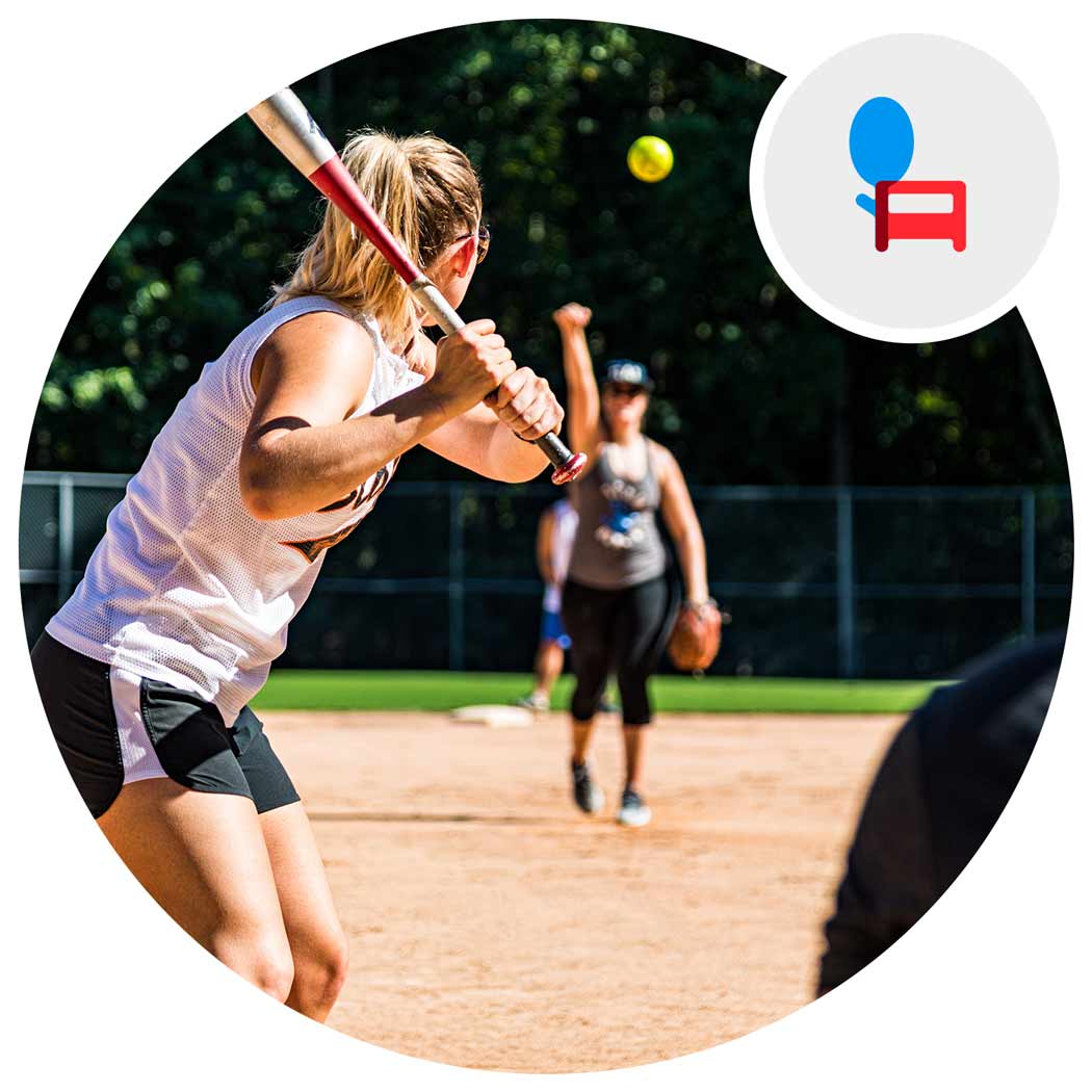 Group playing softball on a summer day