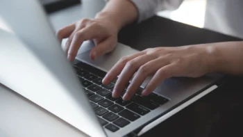 hands at a laptop