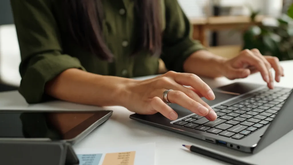 hands on a laptop working