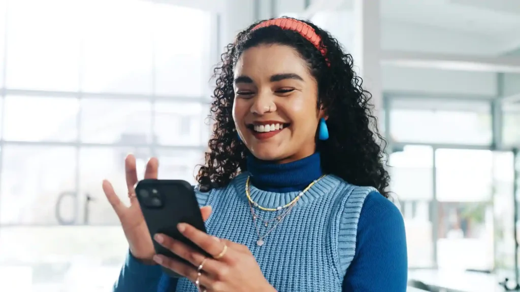 woman typing on cell phone