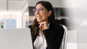 Woman smiling at her desk