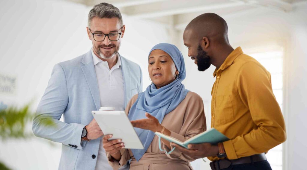 Group reviewing paperwork in an office