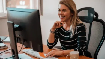 woman sitting at desktop computer