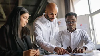coworkers reviewing a document together