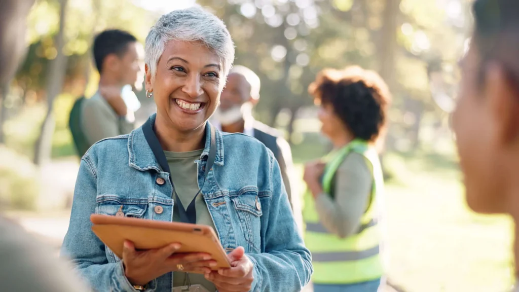woman holding clipboard outdoors