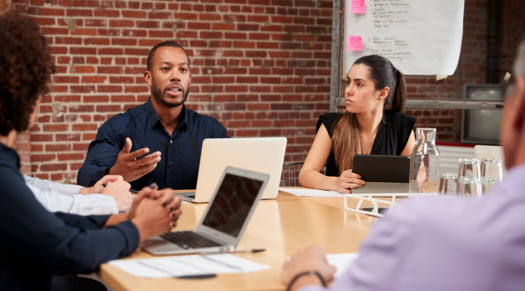 Office table with staff meeting