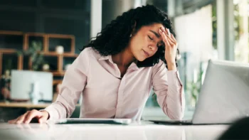 frustrated customer holding her head