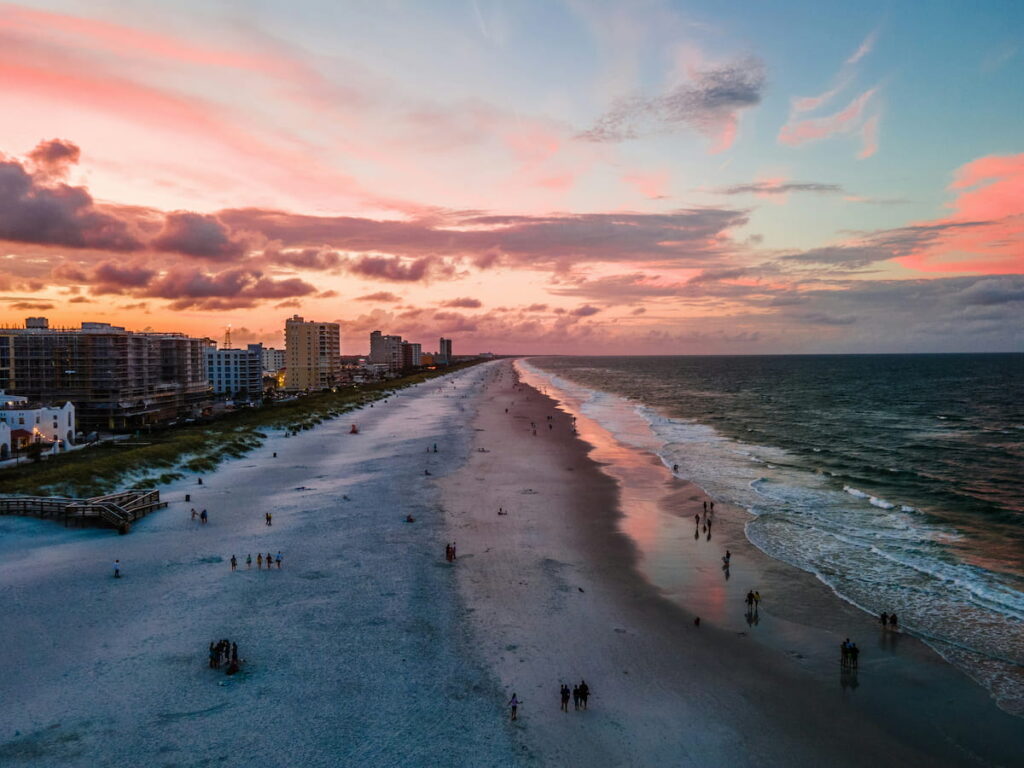 Jacksonville Beach, Florida - aerial photo of beach and water at sunset