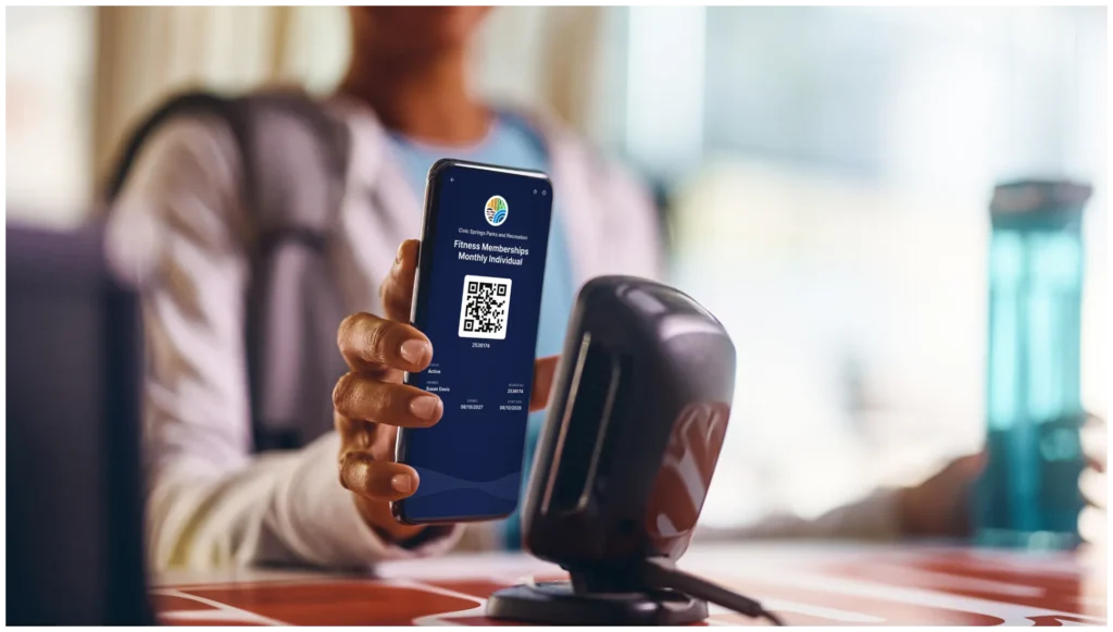 Hand with a phone scanning in a qr code