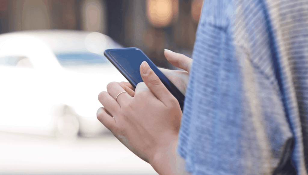 Close up of hands using a cell phone